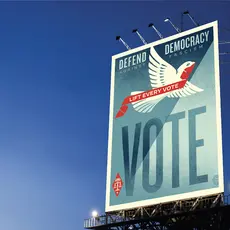 Billboard with art urging people to vote to defend democracy