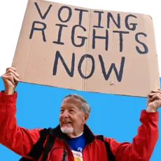 Man holding a sign that reads "voting rights now" 
