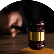 image of hand striking down a gavel