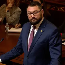 Benjamin Flowers wearing a dark suit