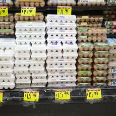 Eggs on a shelf with price tags reading 15.99