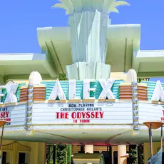 The marque of a movie theater called the Alex Theater showing Christopher Nolan's The Odyssey. 