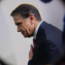A photo of Todd Blanche with a graphic of a magnifying glass around the photo. 