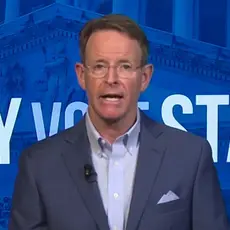 FRC President Tony Perkins faces camera while standing in front of logo of Pray Vote Stand, FRC's annual religious-right activist conference.