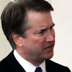A closeup of Brett Kavanaugh furrowing his brow