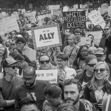 Activists carry signs at the March for Racial Justice
