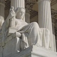 James Earle Fraser's statue The Contemplation of Justice, which sits on the west side of the United States Supreme Court building, on the north side of the main entrance stairs.