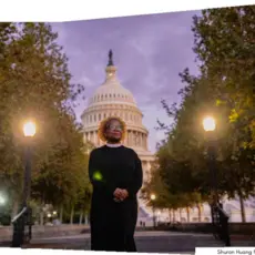 A photograph of Rev. Leslie Watson Wilson in front of the US Capitol Building.