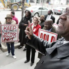 Dr. Tony Minor, right, speaks before a march Tuesday, April 4, 2006 in Cleveland. (AP Photo/Tony Dejak)